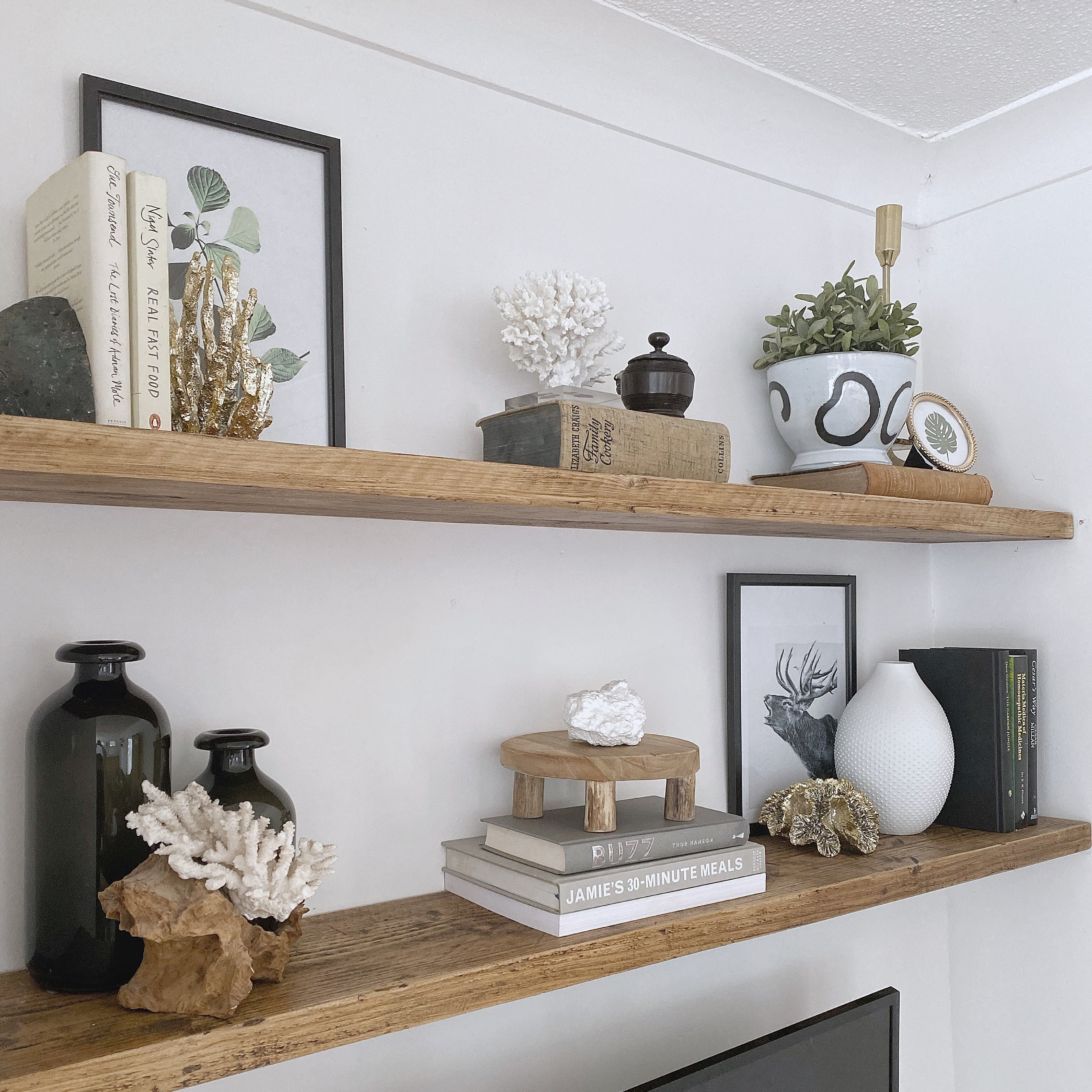 Floating shelves in a living room made from solid rustic wood