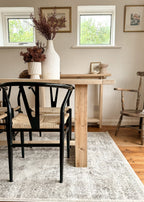 Side view of The Haven Dining Table showing the rustic reclaimed wood finish and available sizes
