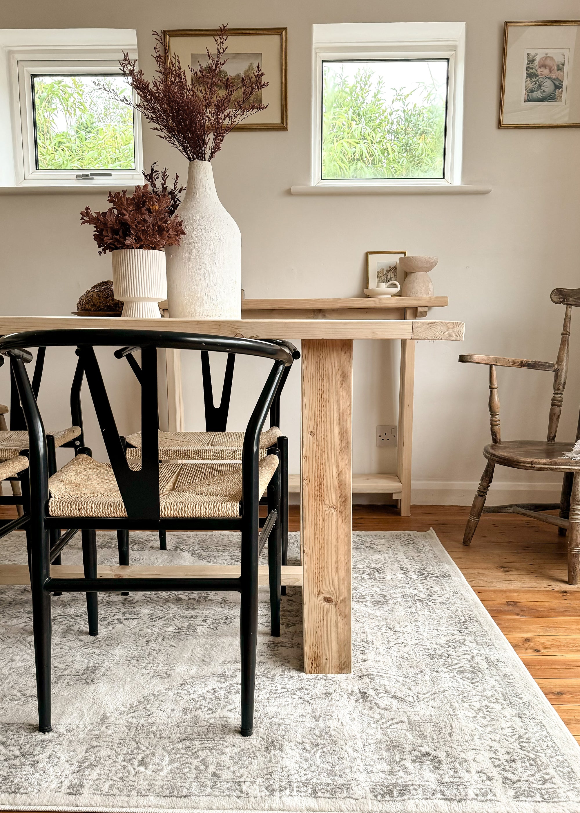 Side view of The Haven Dining Table showing the rustic reclaimed wood finish and available sizes
