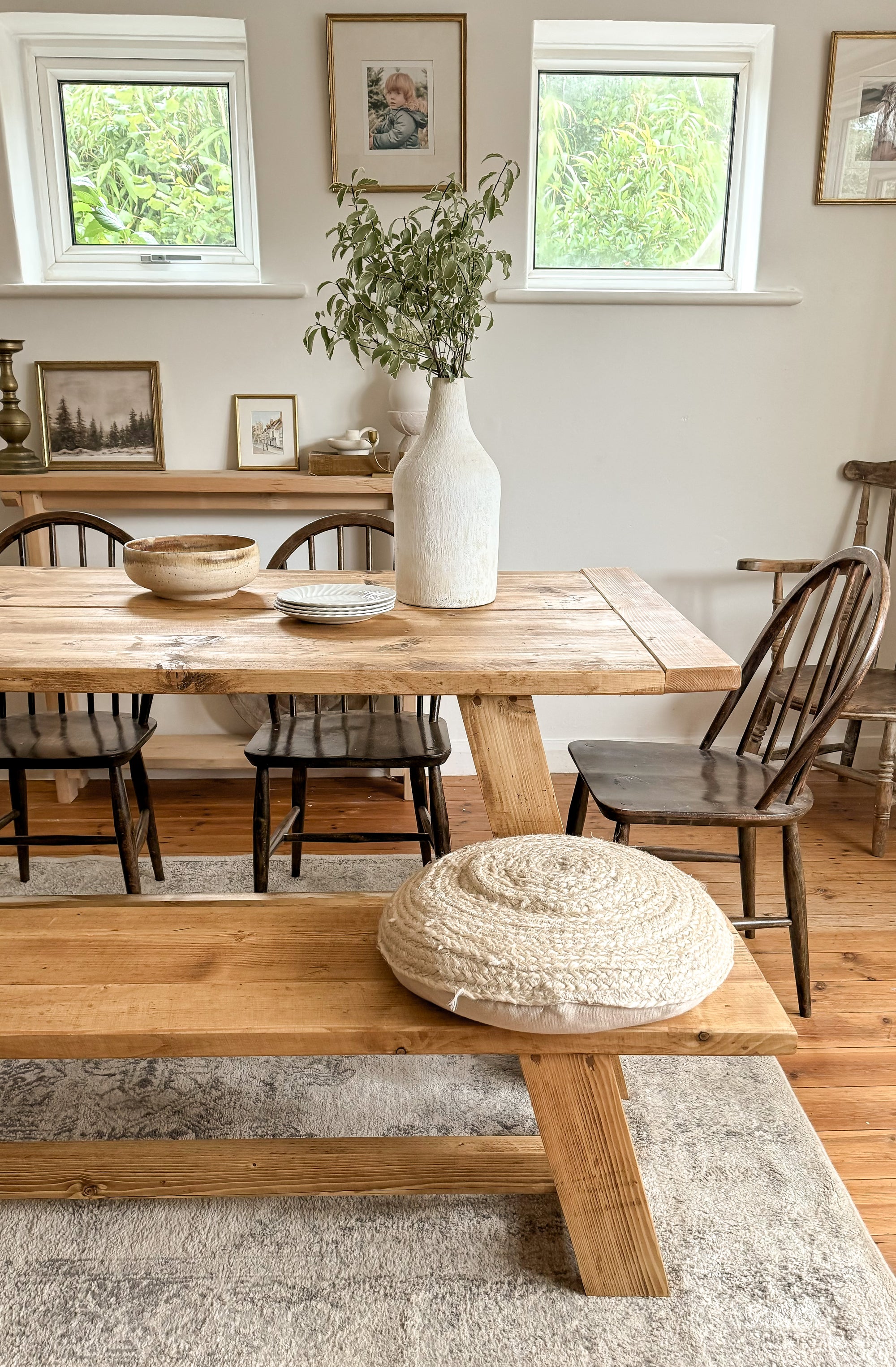 One end of the rustic dining table and bench, showing styling options of chairs and benches