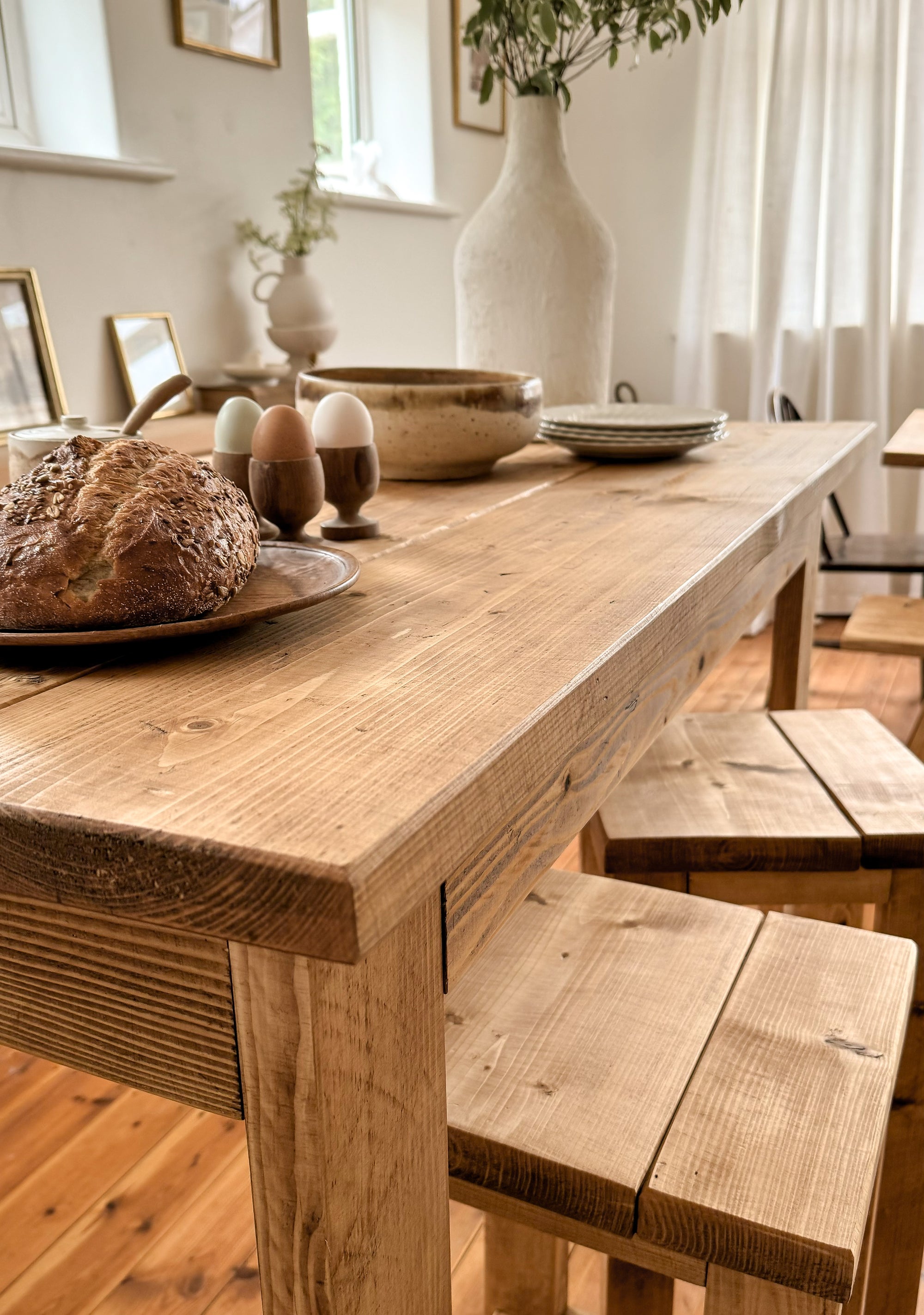 Bar table with bread and eggs in a bright room