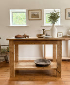 Front view of The Pantry, a freestanding butchers block kitchen island in antique oak with storage shelf.