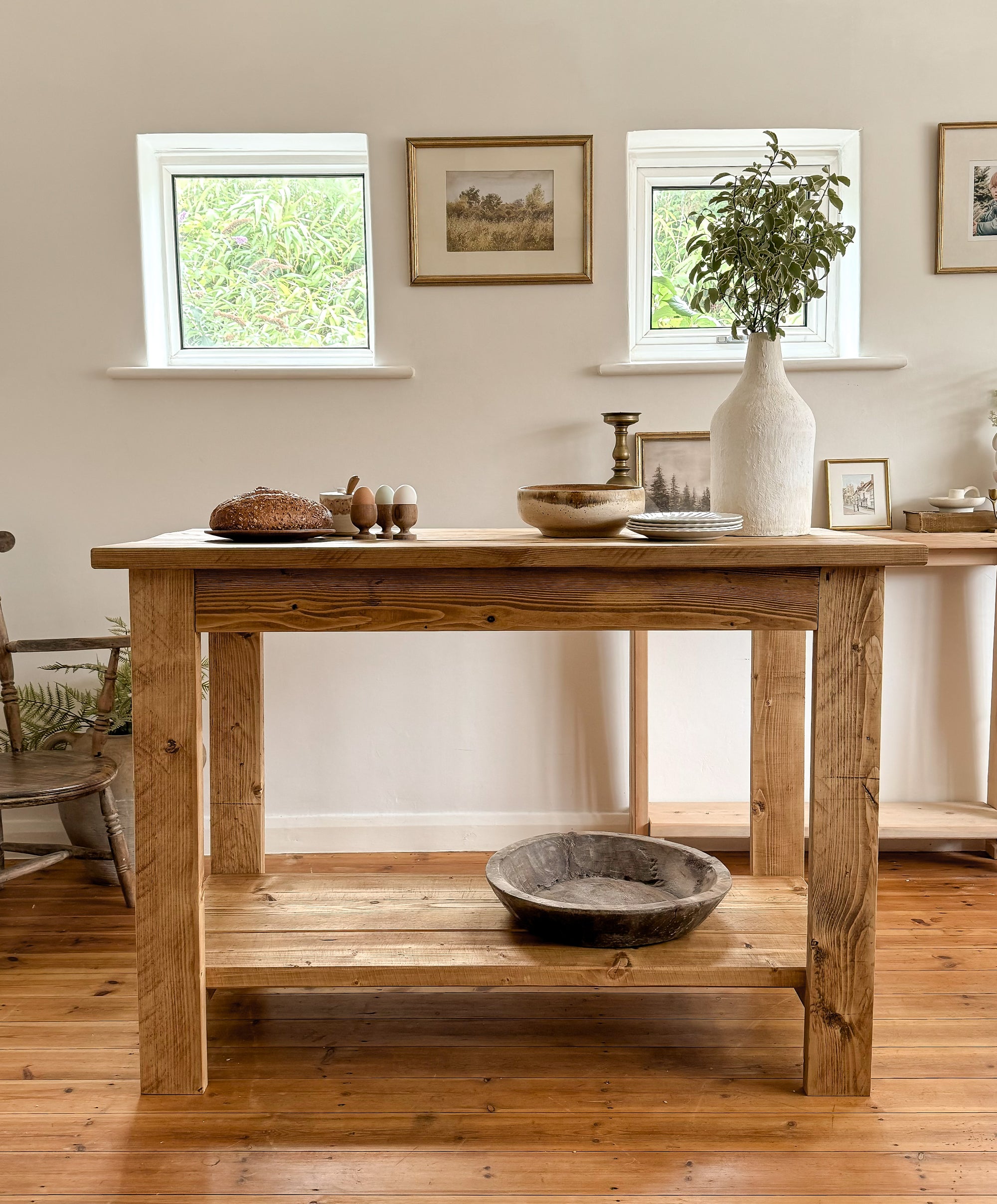 Front view of The Pantry, a freestanding butchers block kitchen island in antique oak with storage shelf.