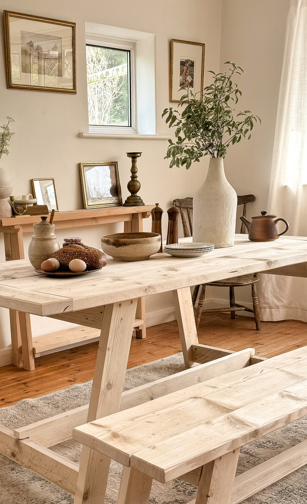 Rustic dining table with bench styled in a family dining room.