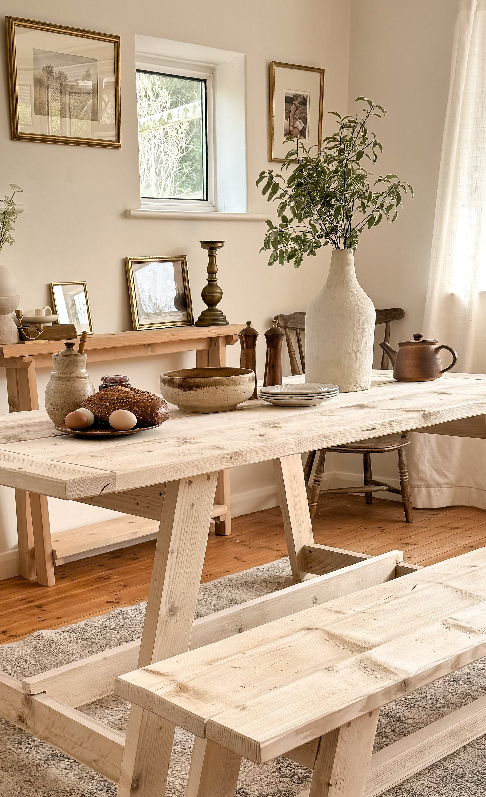 Rustic dining table with bench styled in a family dining room.