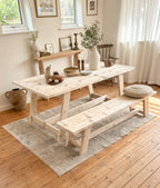 Rustic wooden table and bench set styled in a modern farmhouse kitchen