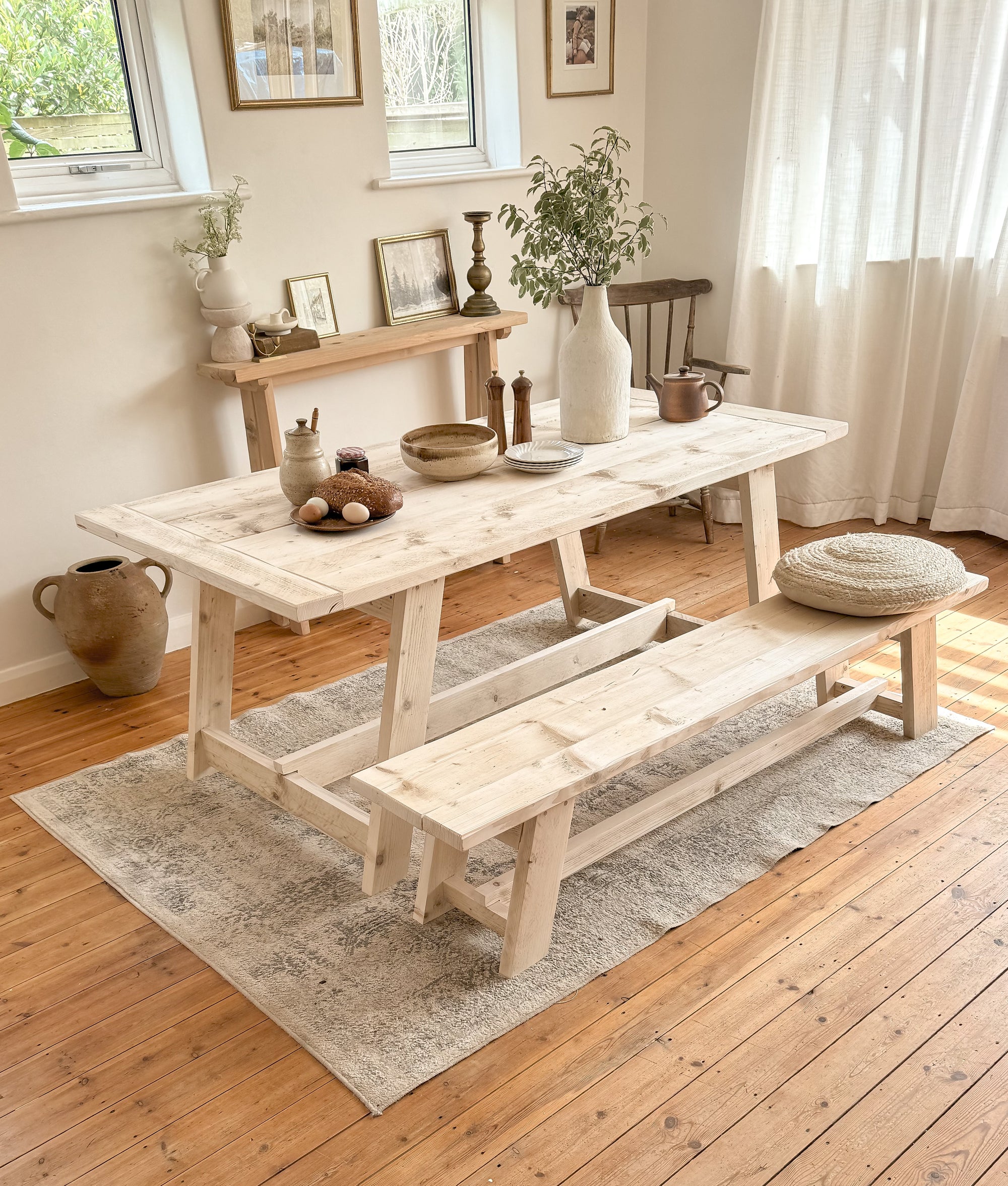 Rustic wooden table and bench set styled in a modern farmhouse kitchen